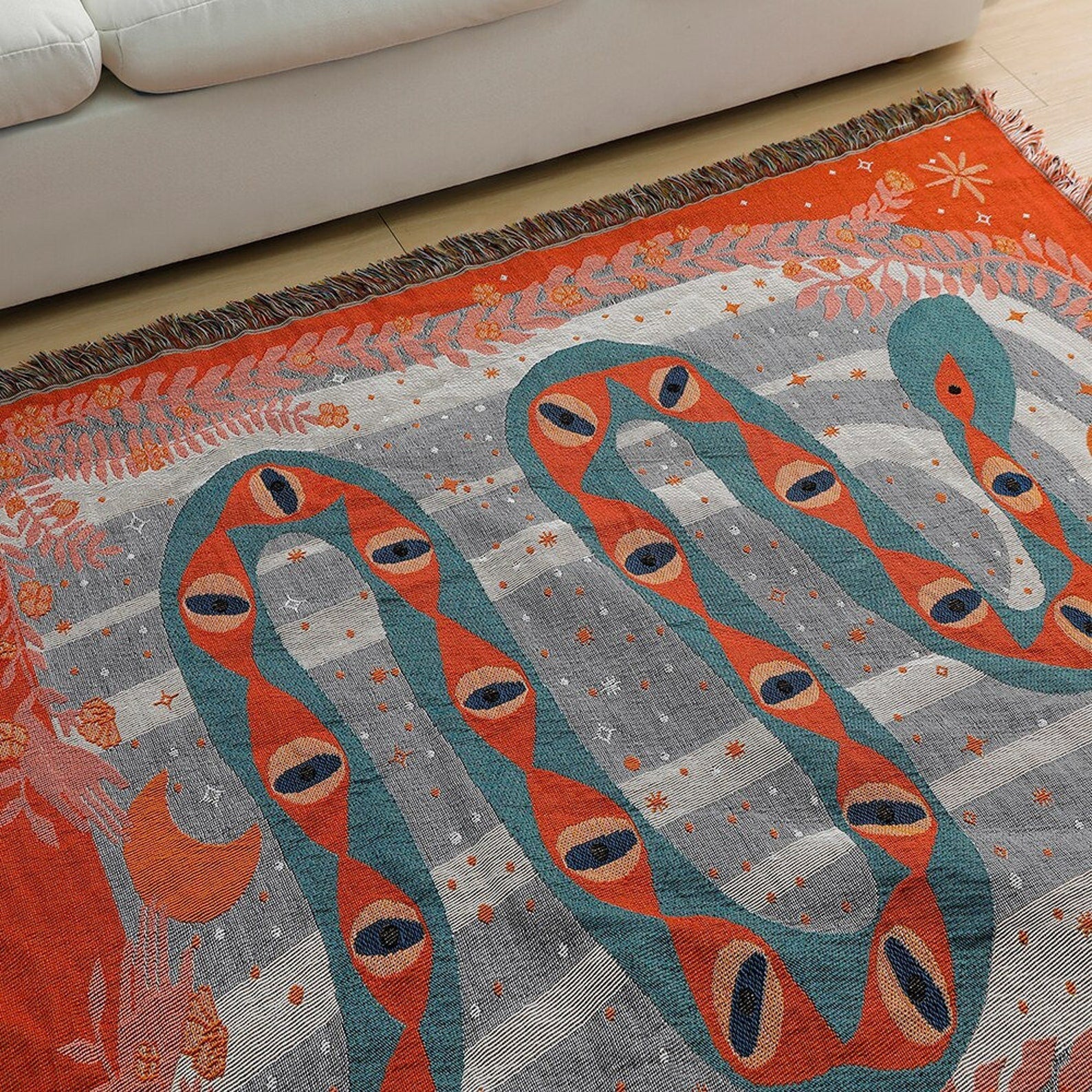 Snake Eyes Woven Throw Blanket Used as area rug image
